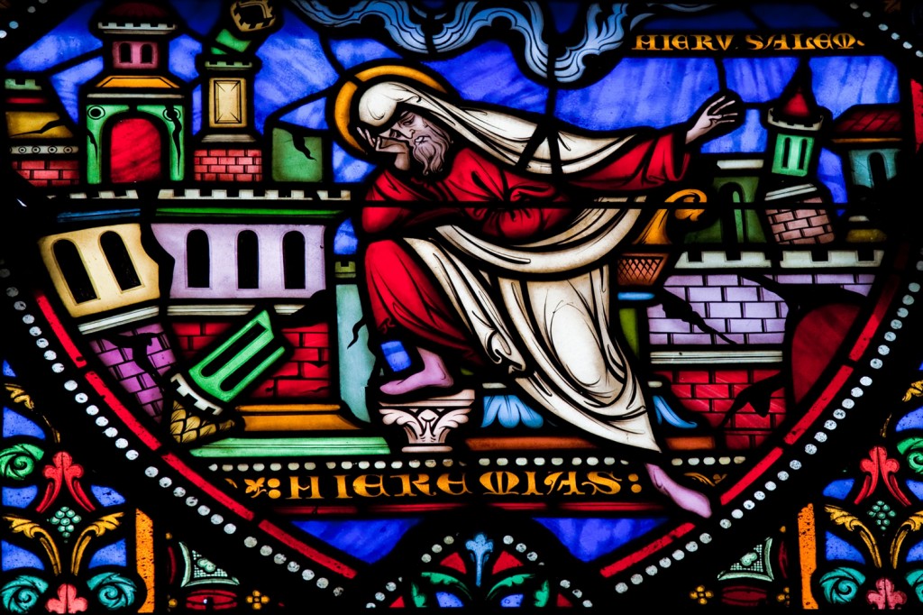 an image of a stained glass window with a picture of a man